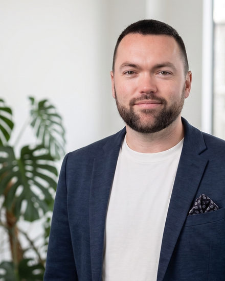Ryon G., General Manager at Tempus, in an office.